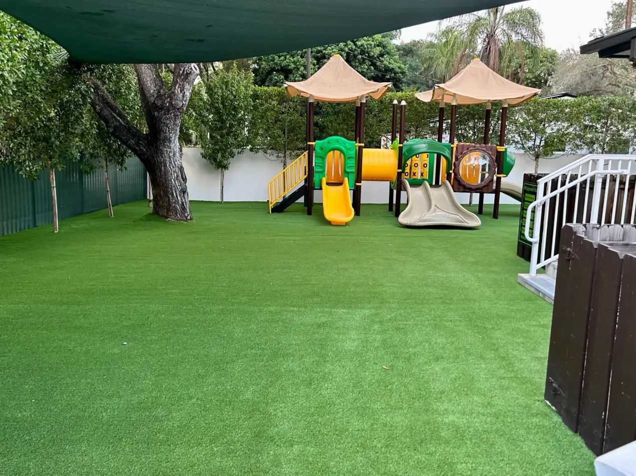 Playground turf installation with IPEMA-certified shock pad system